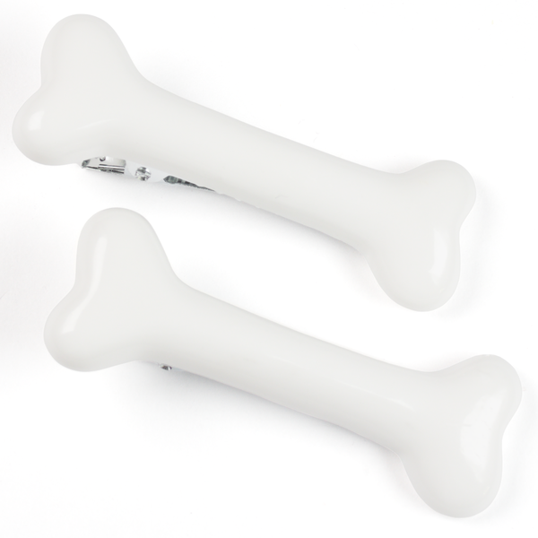 Bone-shaped alligator hair clips in bone white