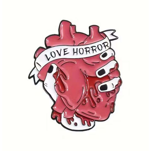 "I Love Horror" anatomical heart enamel pin with a banner