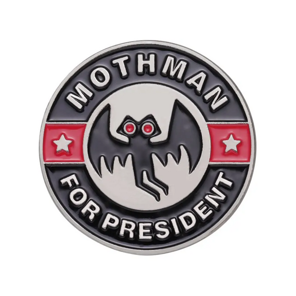 "Mothman for President" enamel pin, a campaign button with glowing red eyes