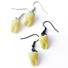 Dentata teeth drop earrings, black and silver pairs shown together