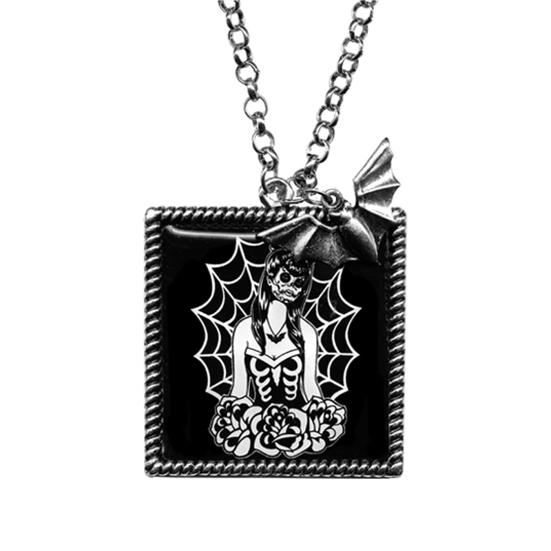 Webbed Girl Frame Necklace, silver-tone rope frame with a Day of the Dead girl in spiderwebs and roses