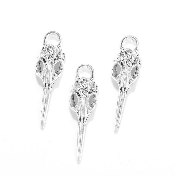 Antique silver crow skull charm